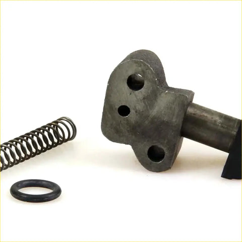 Dark gray metallic tensioner guide chain cam with three circular holes and a shaft for datsun nissan ute models