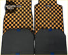 Black and orange checkered tomu car floor mats with textured rubber backing shown from the back side