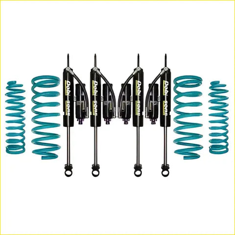Set of four black pro comp shocks with teal coil springs for toyota landcruiser 105 series from dobinsons