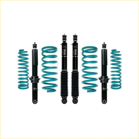 Set of teal coilover suspension components with black shock absorbers for toyota landcruiser prado 90 series by dobinsons