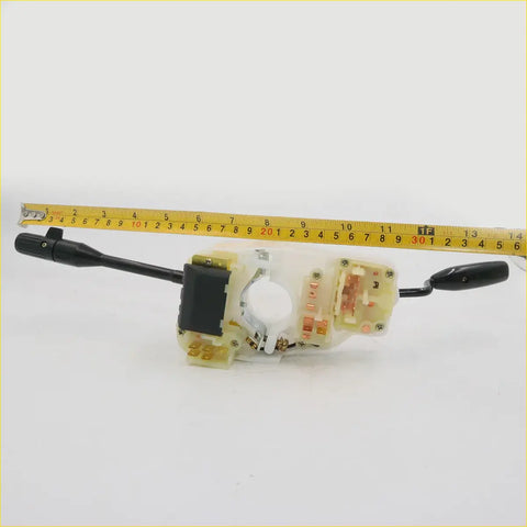 Black and translucent plastic turn signal switch for Nissan Datsun 720 with integrated steering wheel control module