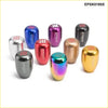 A set of universal racing 5 speed gear shift knobs in colorful metallic finishes including silver blue red and gold