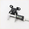Black rubber engine mount with two circular mounting tabs being measured by caliper for toyota hilux door hinge