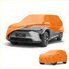 Bright orange waterproof all weather car cover made of durable cotton with zipper snug on gray toyota bZ4X 2022