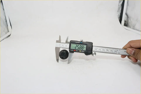 Black cylindrical windscreen washer jet nozzle for datsun nissan 620 measured 25.80 mm with digital caliper