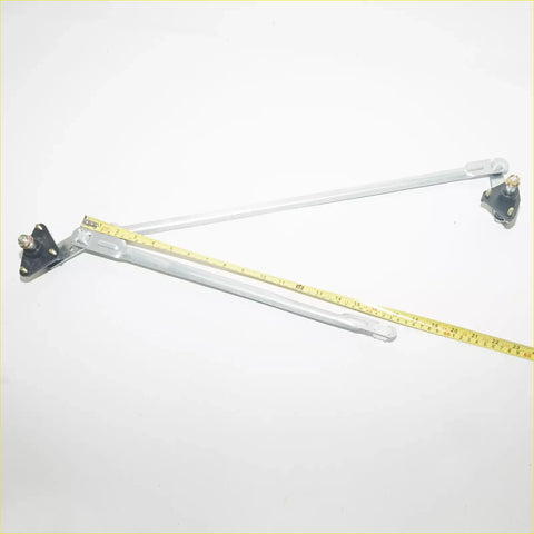 Silver metal windshield wiper linkage arm with black plastic brackets and yellow tape for 1990-1994 nissan sentra sedan