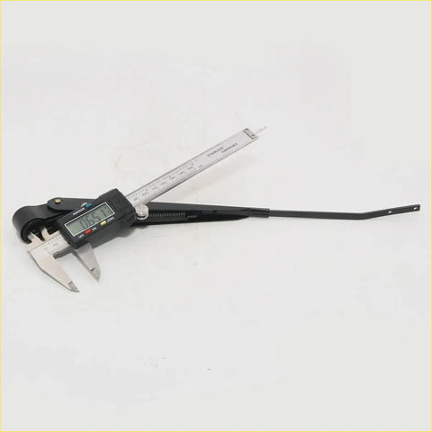 Black digital caliper with stainless steel scale and display measuring a wiper arm assembly for toyota hilux 1978-1983