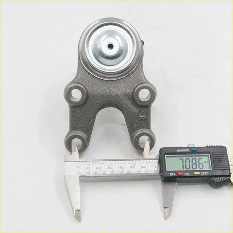 Gray metallic lower ball joint mount with circular rubber top and four holes for datsun junior 140 n140 n141