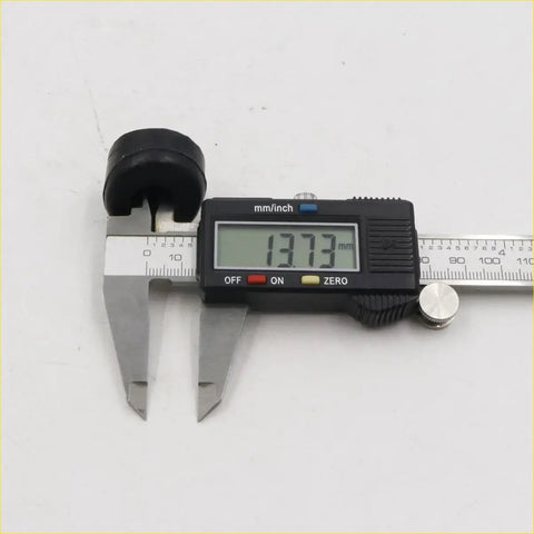 Digital caliper with black and silver body showing 13.73 mm measurement for x2 tail gate rubber bumper nissan datsun